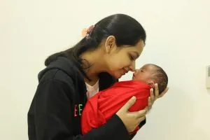 Mother kissing newborn baby lovingly - pregnancy101.in