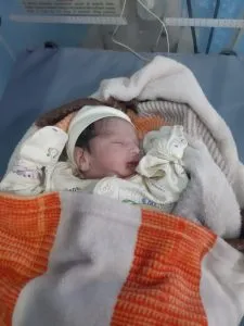 Newborn baby sleeping in cradle - pregnancy101.in