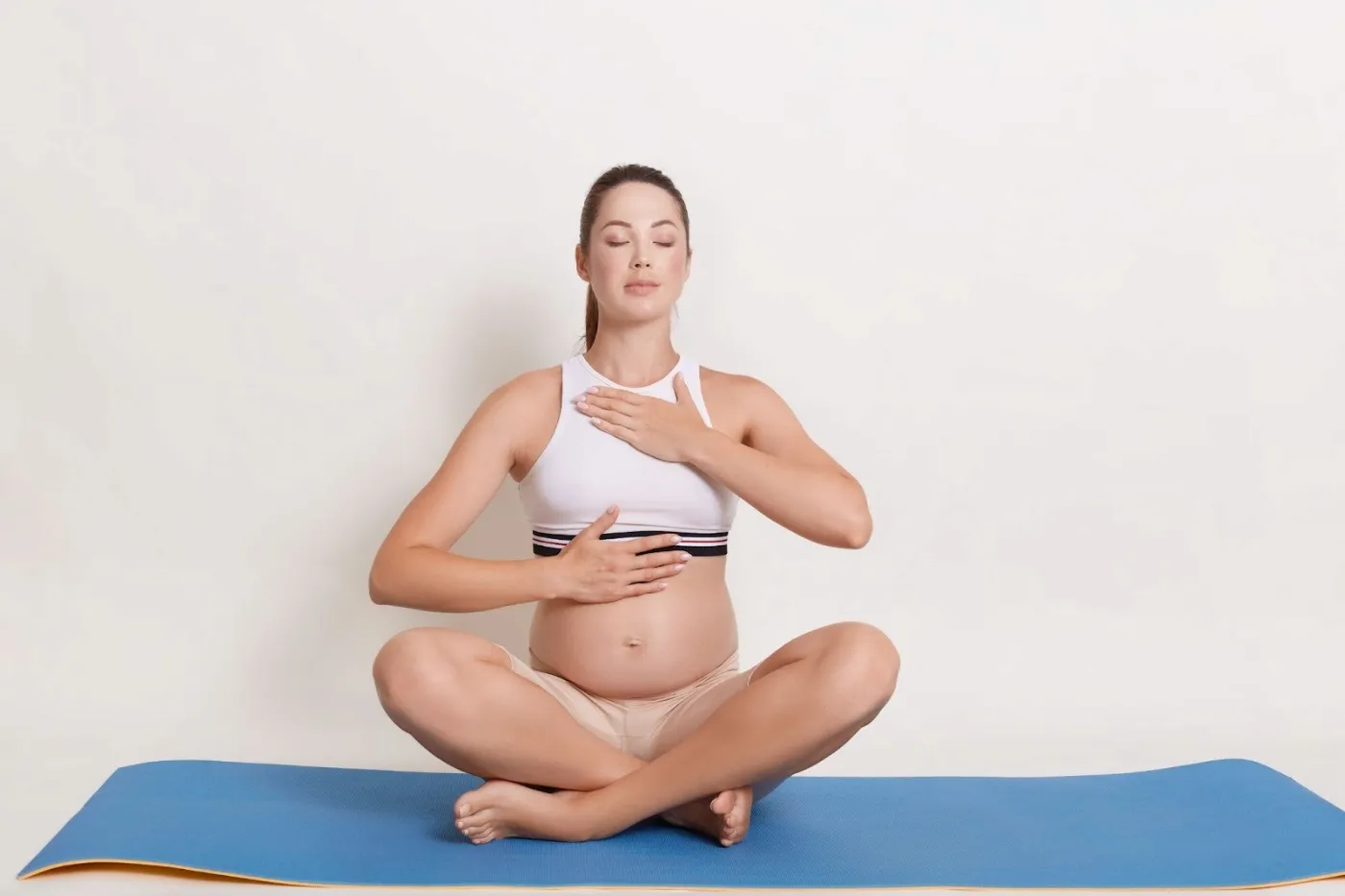Pregnant woman practicing Ujjayi breathing exercise